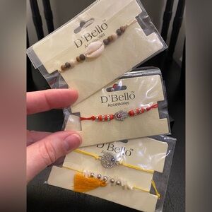 Lot of 4 D’Bello Charm Bracelets - Red String, Yellow String and Cowrie Shell